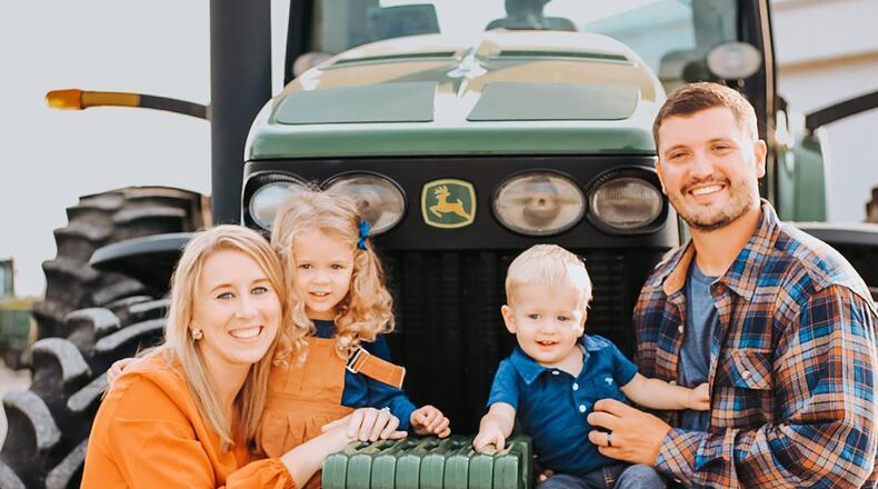 Joe Everett, right, with his wife Casey, daughter Addison, 3, and son Brooks, 1 on the family farm. CONTRIBUTED