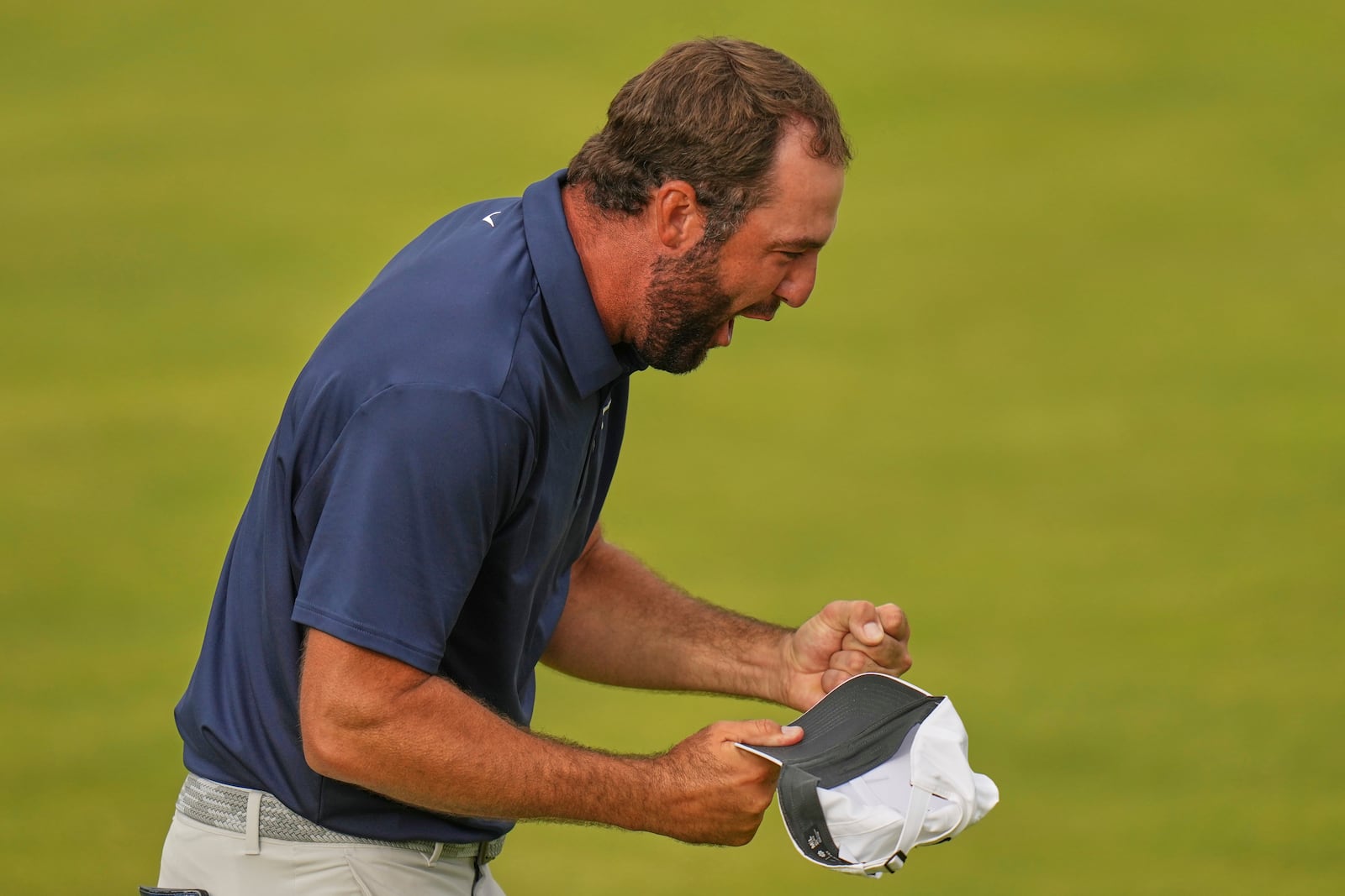 Scottie Scheffler of the United States celebrates after winning the British Open golf championship at the Royal Portrush Golf Club, Northern Ireland, Sunday, July 20, 2025. (AP Photo/Francisco Seco)