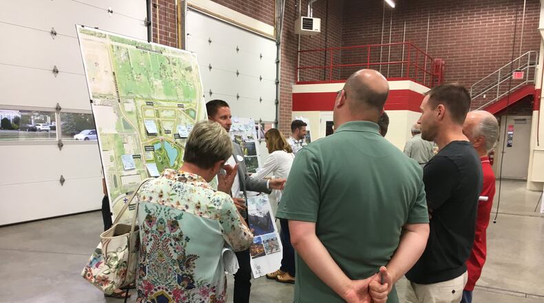 A consultant facilitates a conversation about possible public uses for a portion of the former Kingswood golf course into a downtown central gathering place for Deerfield Twp. Residents were asked Monday, Sept. 25 for feedback on several conceptual drawings during the session for the proposed mixed use development. This was the first of three public input sessions hosted by Deerfield Twp. trustees. ED RICHTER/STAFF