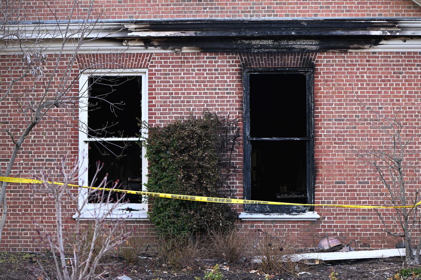 Charred wood trim and brick are visible at the Pennsylvania governor's official residence after a man was arrested in the alleged arson that forced Gov. Shapiro, his family and guests to flee in the middle of the night on the Jewish holiday of Passover, Sunday, Apr. 13, 2025, in Harrisburg, Pa. (AP Photo/Marc Levy)