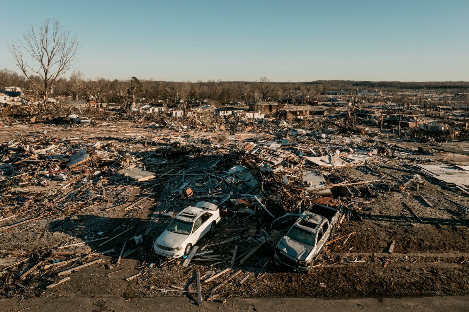 A heavily damaged neighborhood in Dawson Springs, Ky., on Monday, Dec. 13, 2021, where a tornado flattened much of the town on Friday night. After grimly fluctuating death tolls since Friday’s devastating swarm of tornadoes, Gov. Andy Beshear of Kentucky said on Monday that there were 64 confirmed deaths in the state, though he expected that number to rise as crews continued to search through the ruins. (William Widmer/The New York Times)