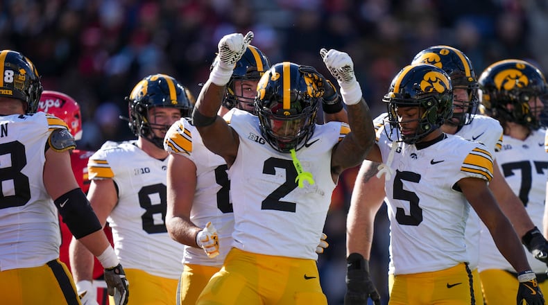 Iowa running back Kaleb Johnson (2) dances while celebrating his touchdown during the first half of an NCAA college football game against Maryland, Saturday, Nov. 23, 2024, in College Park, Md. (AP Photo/Stephanie Scarbrough)