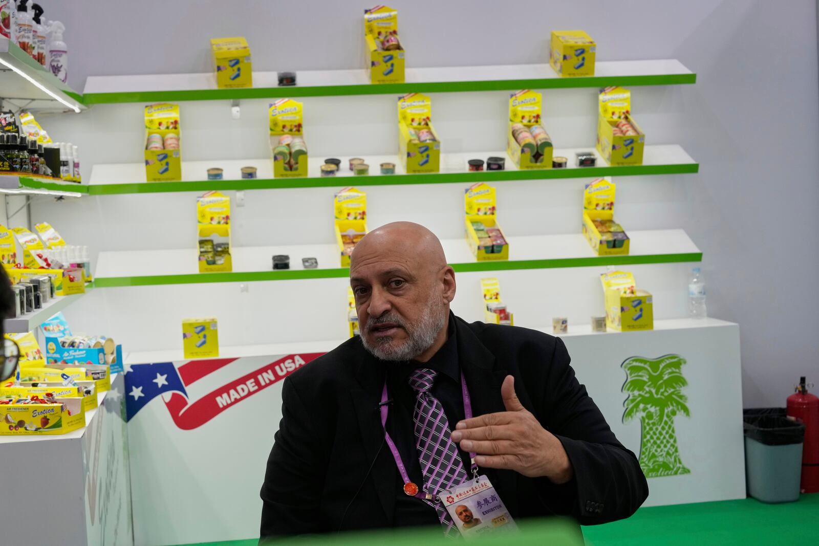Danny Elassir, export director with Exotica Freshener Co, a U.S. company selling fresheners, speaks at the 137th Canton Fair in Guangzhou in southern China's Guangdong province, Tuesday, April 15, 2025. (AP Photo/Ng Han Guan)