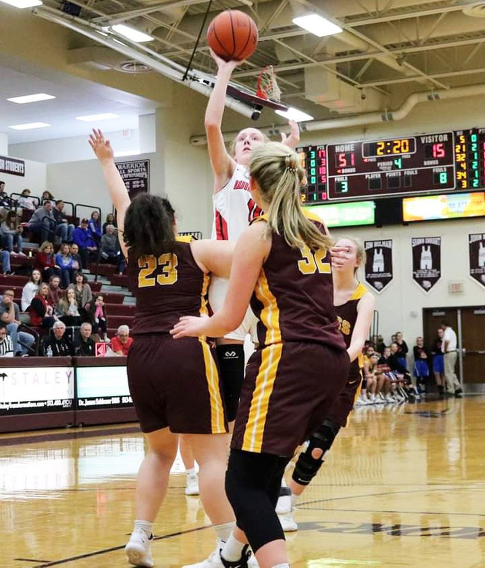 Franklin’s Jordan Rogers shoots over Kellan Romans (23) and Dakota Snyder (32) of Ross on Saturday afternoon at Lebanon. Franklin won the Division II sectional opener 53-16. CONTRIBUTED PHOTO BY TERRI ADAMS
