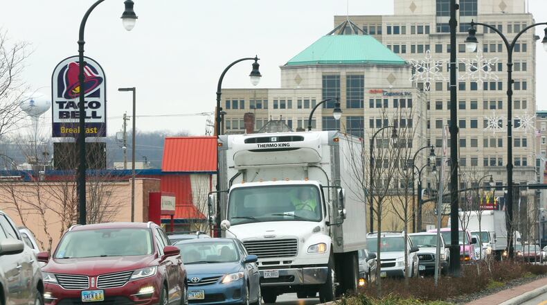 Hamilton City Manager Joshua Smith has had it up to here with how long it takes to drive along High Street in the city, and wants to tweak the traffic-signal timing in an effort to improve it. GREG LYNCH / STAFF