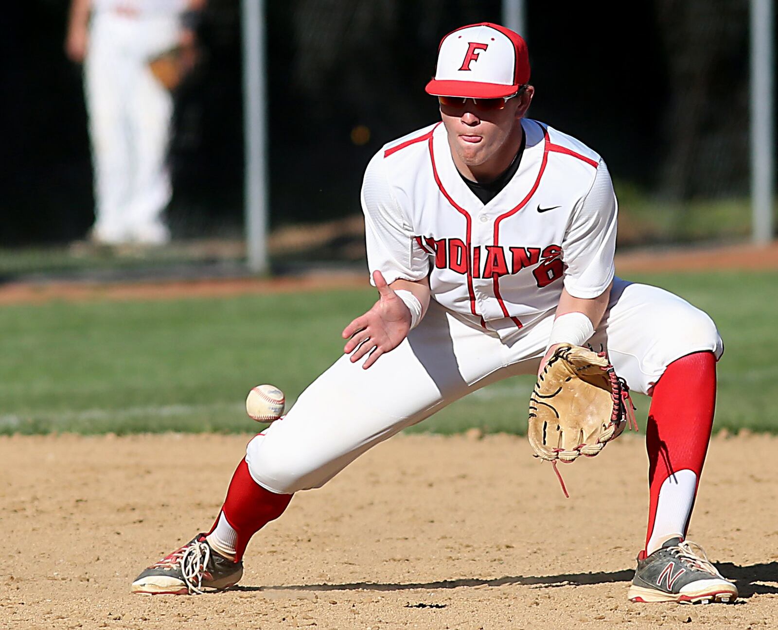 Fairfield third baseman Andrew Sams fields a Hamilton ground ball during Sunday’s game at Joe Nuxhall Field in Fairfield. CONTRIBUTED PHOTO BY E.L. HUBBARD