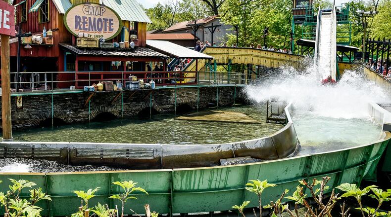 Park visitors ride the log ride at Kings Island amusement park on May 11 in Mason.NICK GRAHAM/STAFF