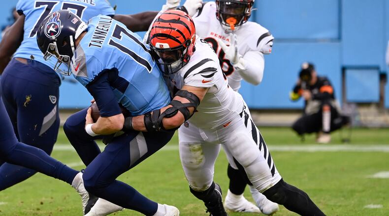 Cincinnati Bengals defensive end Sam Hubbard (94) sacks Tennessee Titans quarterback Ryan Tannehill (17) during the second half of an NFL football game, Sunday, Nov. 27, 2022, in Nashville, Tenn. (AP Photo/Mark Zaleski)