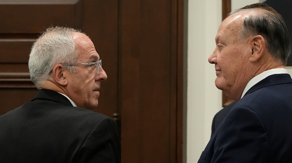 Defendants Michael Dowling, left, and Chuck Jones wait for the start of their trial in Summit County Court of Common Pleas Judge Susan Baker Ross's courtroom on Tuesday, Feb. 3, 2026, in Akron, Ohio. (Mike Cardew/Akron Beacon Journal via AP, Pool)