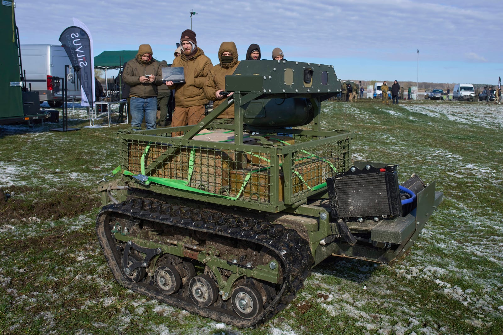 FILE - A manufacturer demonstrates a Ukrainian made unmanned ground vehicle at a Ukraine Defense Innovations exhibition for military clients on an undisclosed location in Ukraine, Friday, April 11, 2025. (AP Photo/Efrem Lukatsky, File)