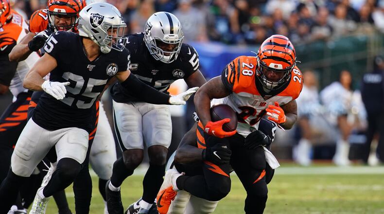 OAKLAND, CALIFORNIA - NOVEMBER 17: Joe Mixon #28 of the Cincinnati Bengals runs the ball during the second half against the Oakland Raiders at RingCentral Coliseum on November 17, 2019 in Oakland, California. (Photo by Daniel Shirey/Getty Images)