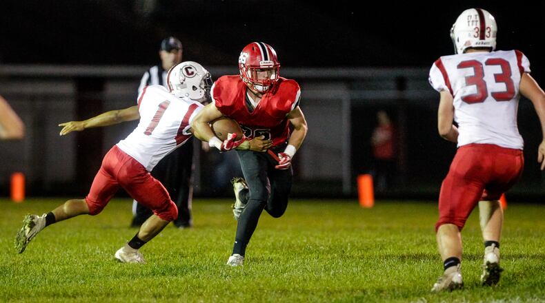 Madison’s Cameron Svarda carries the ball during a 54-0 win over visiting Carlisle on Oct. 5 at Brandenburg Field in Madison Township. NICK GRAHAM/STAFF