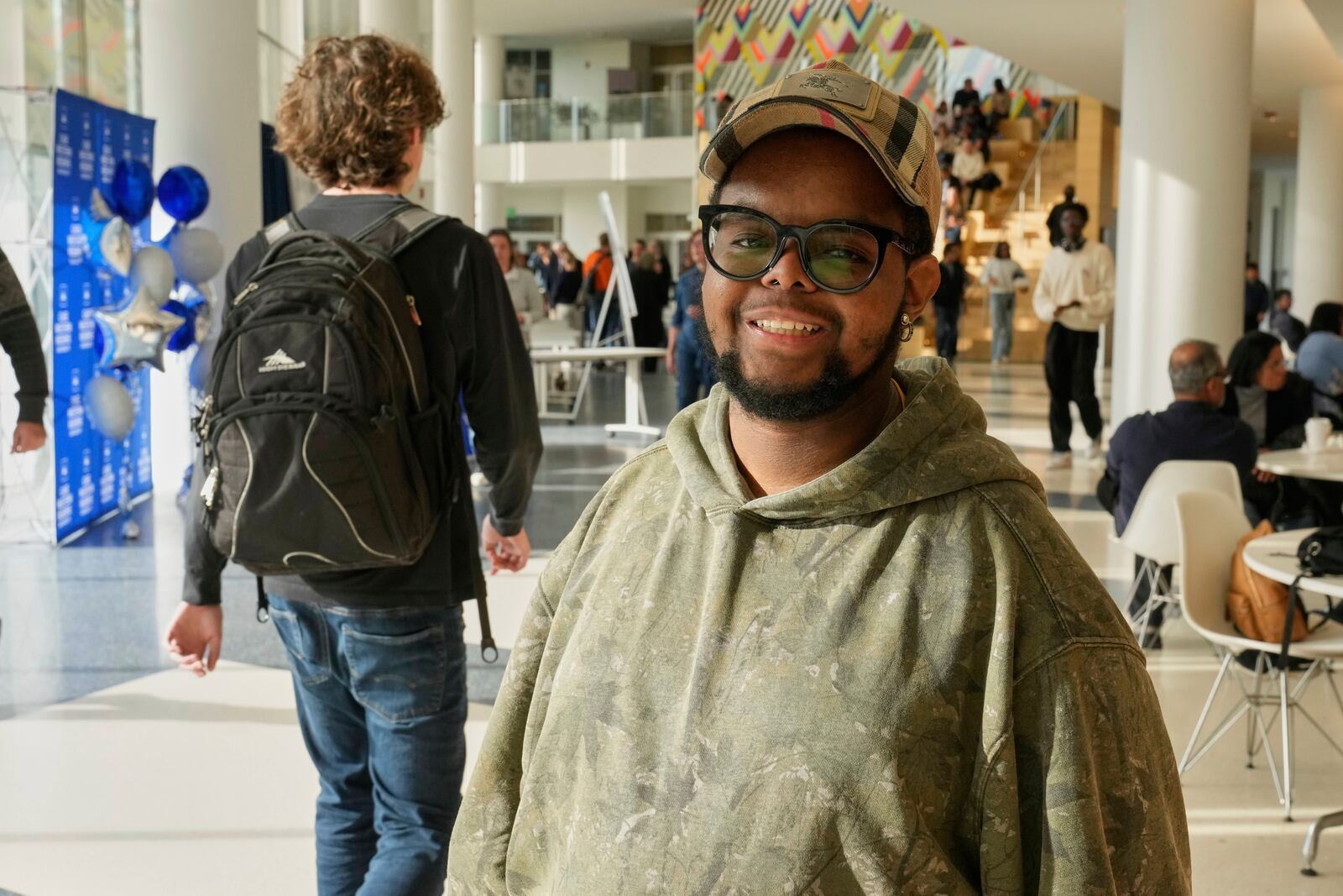 Case Western Reserve University student. Justen Pippens poses for a photo in the student union at the school In Cleveland Thursday, April 17, 2025. (AP Photo/Sue Ogrocki)