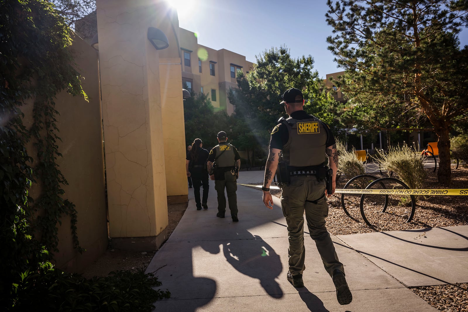 Authorities investigate a deadly shooting at Casas del Rio (Gila), a student housing center at the University of New Mexico Central Campus. early Friday, July 25, 2025 in Albuquerque, N.M. (Chancey Bush/The Albuquerque Journal via AP)