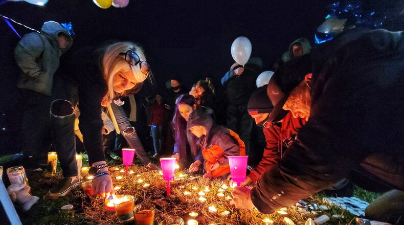 Over 100 people attended a vigil for a Middletown child who was allegedly killed by his mother. The community released balloons, lit candles and held a moment of silence at the vigil at Gardner Park Monday evening.
James Robert Hutchinson was reported missing on Sunday to Middletown police, but detective interviews with the boy’s mother, Brittany Gosney, 29, and James Hamilton, 42, determined James was killed a few days before in Preble County. The child’s body was returned to Middletown and later put in the Ohio River, according to Middletown police. NICK GRAHAM / STAFF
