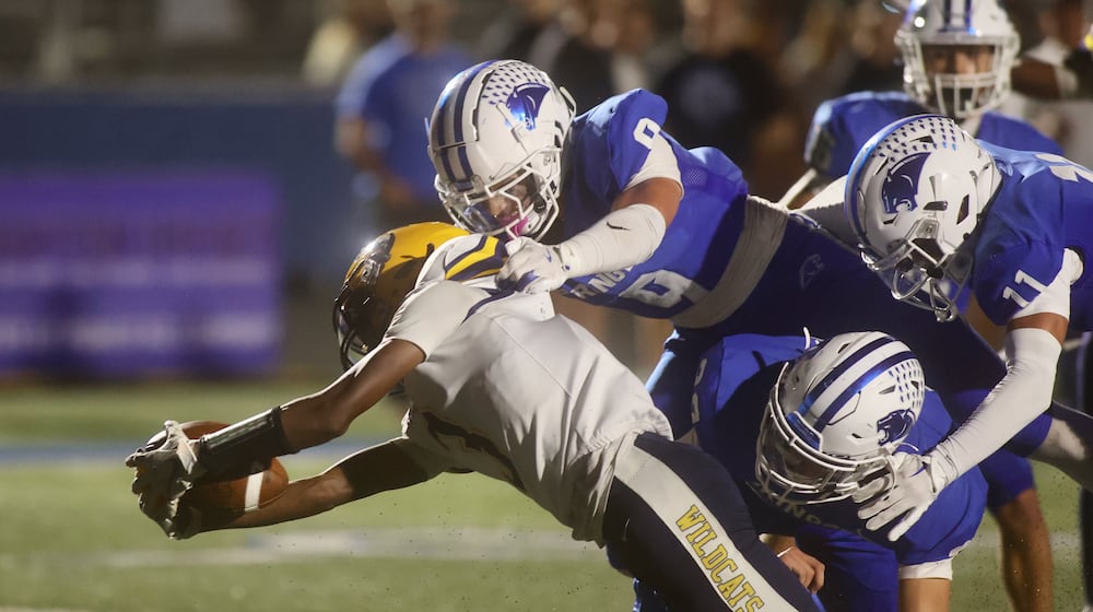 Springfield's Braylon Keyes stretches for a touchdown in the second quarter against Springboro on Friday, Sept. 26, 2025, at CareFlight Field in Springboro. David Jablonski/Staff