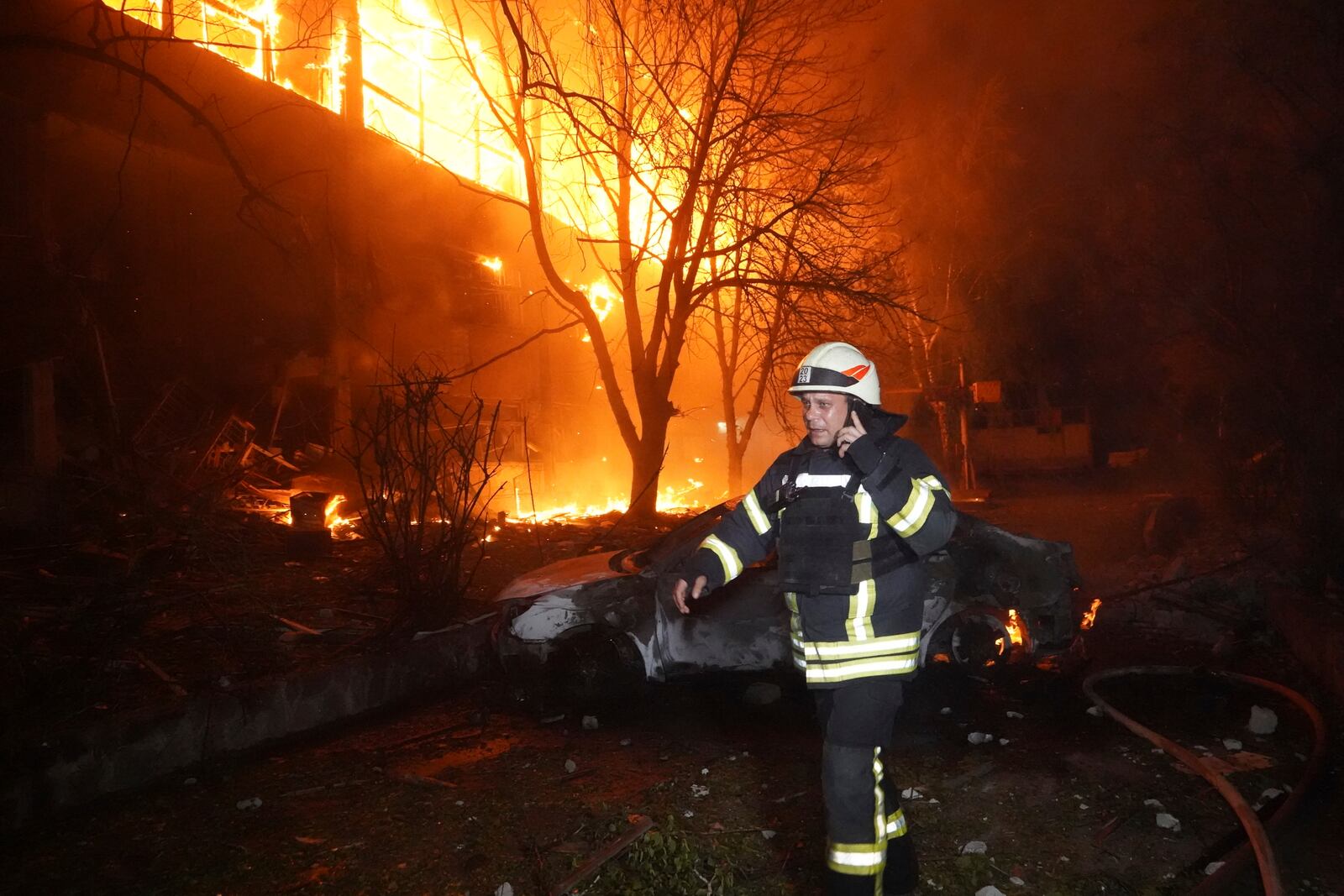Firefighters tackle a blaze after a Russian attack that hit a residential building in Kharkiv, Ukraine, Wednesday, June 11, 2025. (AP Photo/Andrii Marienko)