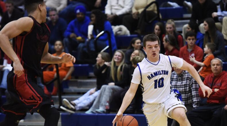 Hamilton’s Ryan Robinson drives to the hoop for a shot during a game against visiting Oak Hills on Jan. 8, 2016, at the Hamilton Athletic Center. NICK GRAHAM/STAFF