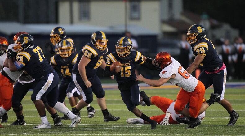 Springfield’s Kendric Holt makes a run against Beavercreek last Friday at Evans Stadium in Springfield. The host Wildcats won 64-28. DAVID JABLONSKI/STAFF