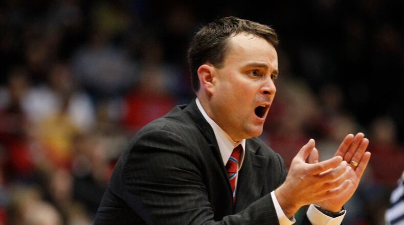 Dayton coach Archie Miller encourages his players on Wednesday, Nov. 13, 2013, at UD Arena. David Jablonski/Staff David Jablonski/Staff