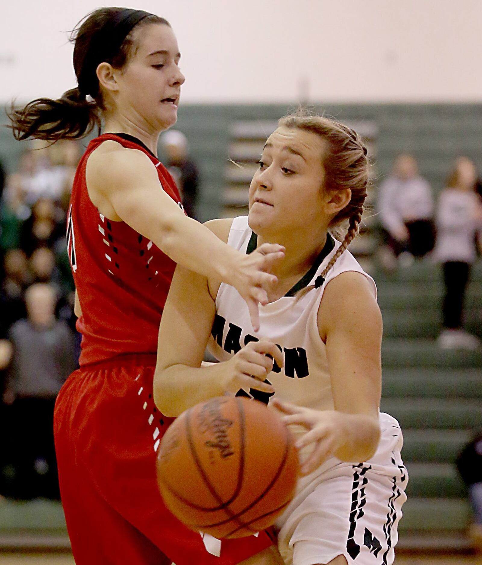 Lakota West’s Madisyn Oxley (left) tries to block Saylor Norton of Mason on Saturday afternoon at the Mason Arena. CONTRIBUTED PHOTO BY E.L. HUBBARD