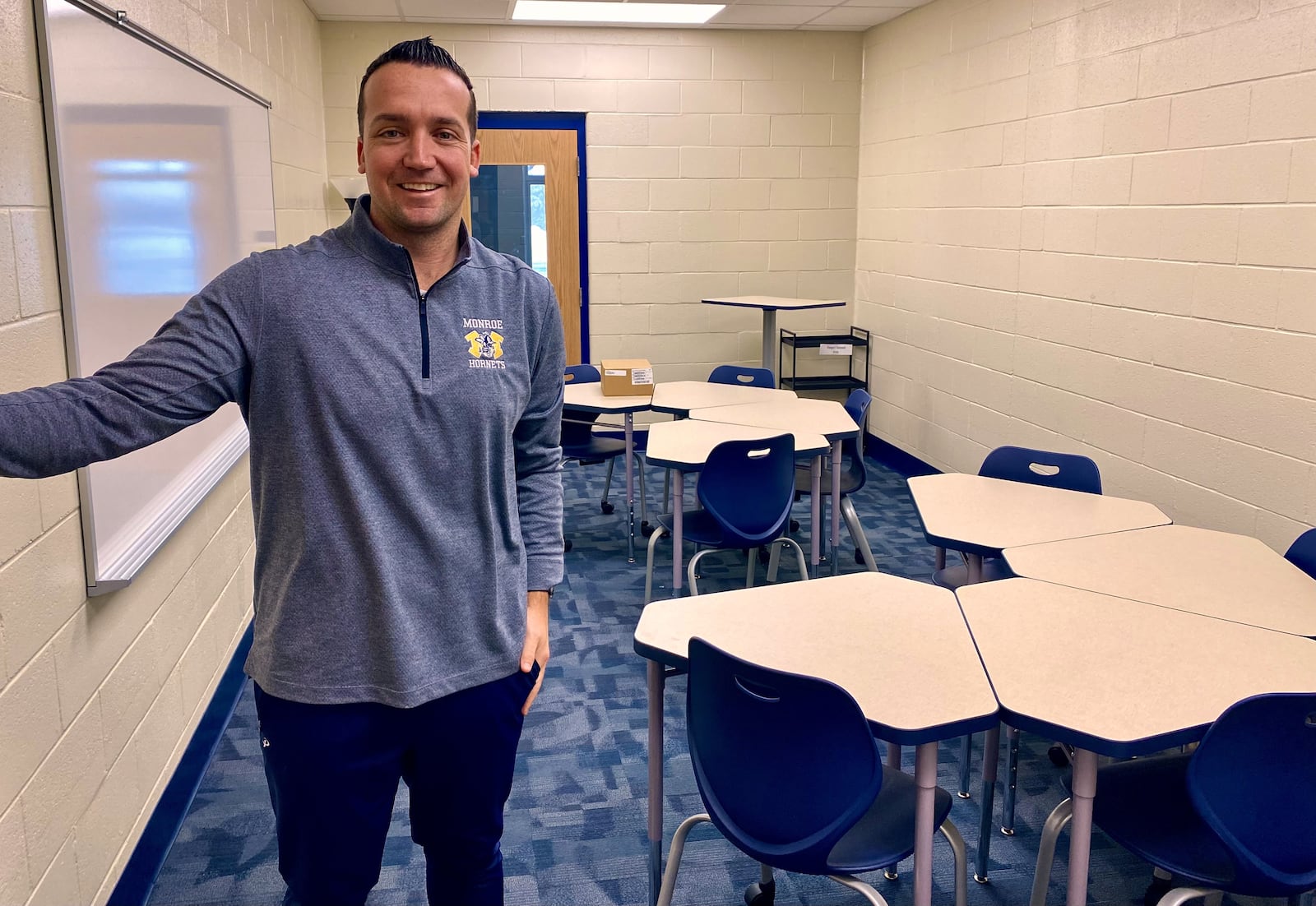 Later this week, a new wing of classrooms will be unveiled to teachers at Monroe Junior and Senior High School helping to soon bring some overcrowding relief in the fast-growing school system. Last year, Monroe school officials decided to undertake a rare building renovation by beginning construction work to convert a junior high gym into 8 new classrooms in two stories along with two smaller, learning conference rooms. Pictured in one of those rooms is Monroe Jr. High Principal Logan Stanger. (Photo By Michael D. Clark/Journal-News)