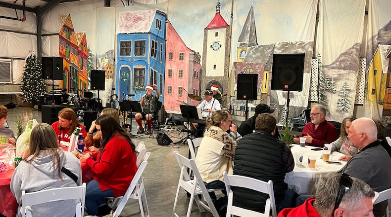 Hamilton’s Christkindlmarkt will be held 5-9 p.m. today, and 11 a.m.-9 p.m. Saturday at Butler County Fairgrounds, 1715 Fairgrove Ave., Hamilton. A German-style holiday market offers visitors German wares, food, drinks, live music and more. Pictured is the entertainment at the 2023 event. AMY BURZYNSKI/STAFF