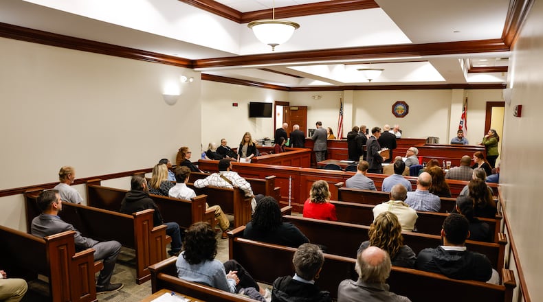 Butler County Area II Court Judge Kevin McDonough sits on the bench during the first docket day at the new location inside the old Hamilton municipal court at Butler County Government Services Center in Hamilton. Area I and Area II courts will work out of this courtroom. Judge McDonough is still waiting on a replacement robe after his was damaged in a fire at the historic Butler County Courthouse. NICK GRAHAM/STAFF