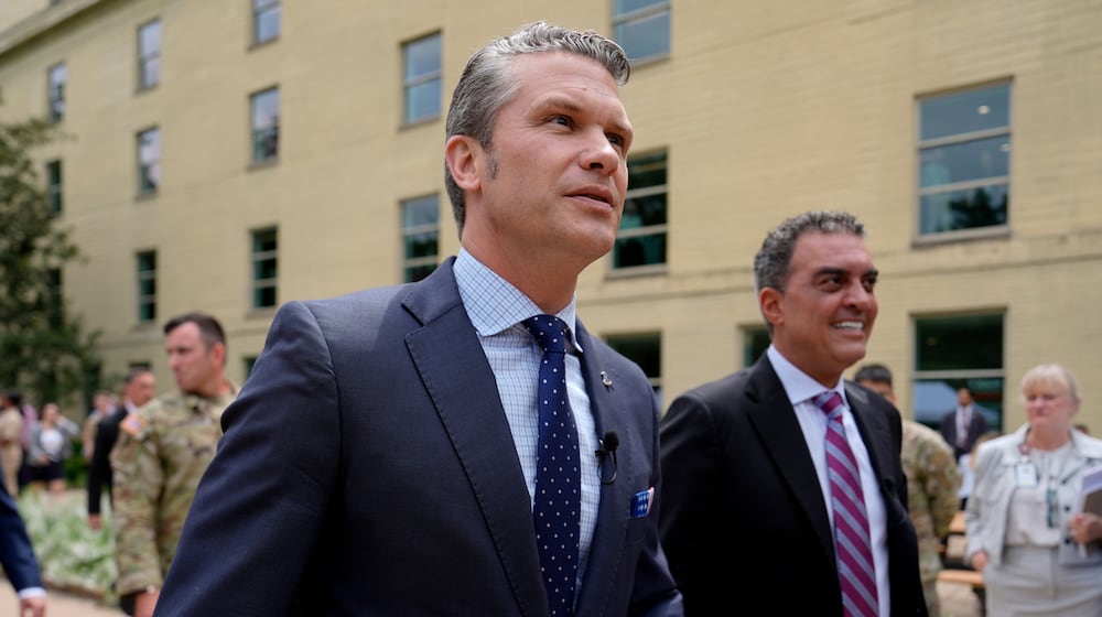 FILE- Secretary of Defense Pete Hegseth, left, and Under Secretary of Defense for Research and Engineering Emil Michael, right, arrive to look at a display of multi-domain autonomous systems in the Pentagon courtyard, Wednesday, July 16, 2025, in Washington. (AP Photo/Julia Demaree Nikhinson, File)