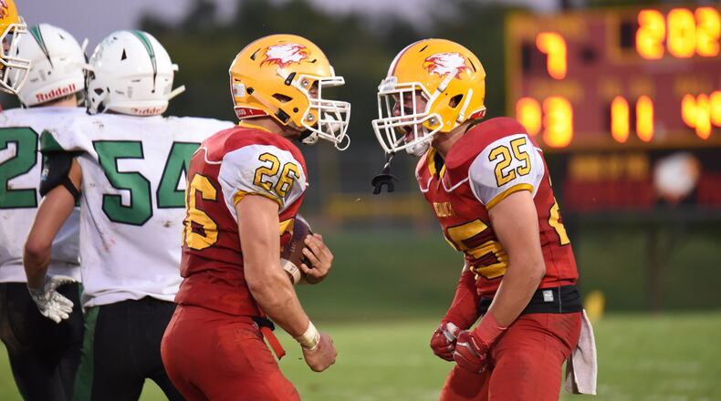 Fenwick’s Logan Miller (26) and David Schuh (25) show their emotion after a Miller interception during last season’s 21-9 triumph over visiting Badin at Krusling Field in Middletown. CONTRIBUTED PHOTO BY ANGIE MOHRHAUS