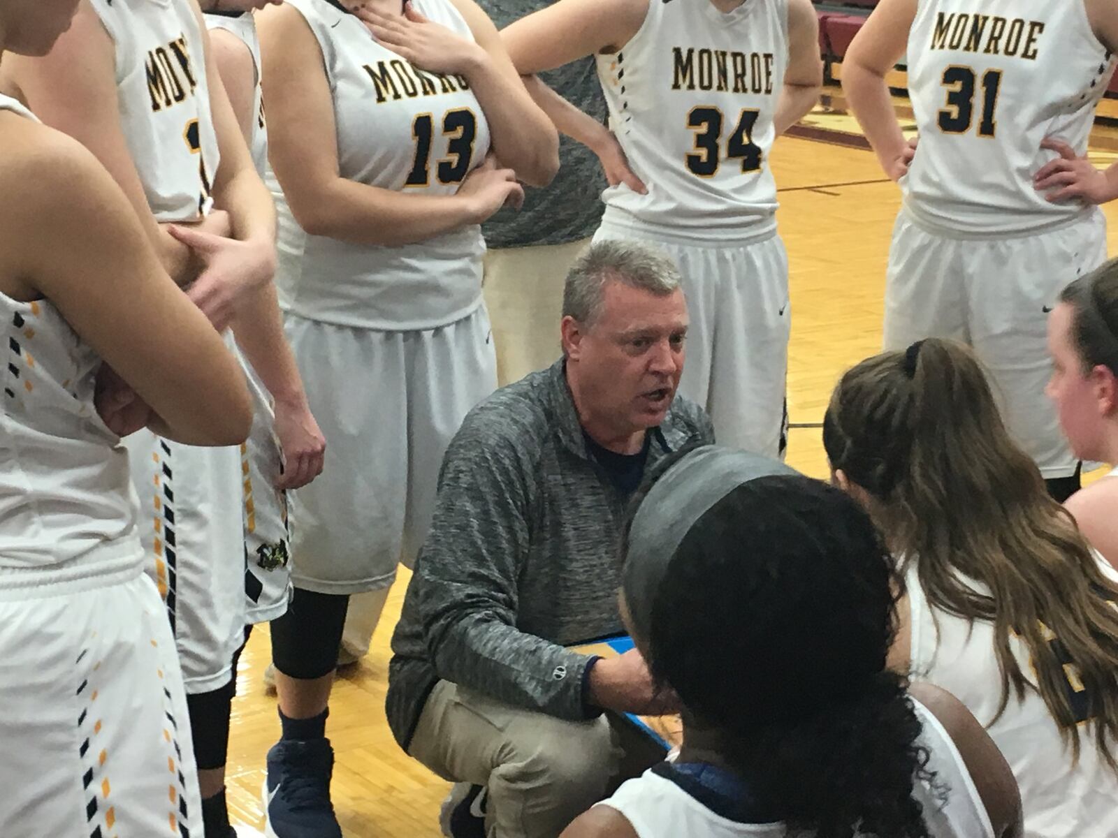 Monroe coach Chad Allen talks to his team during a timeout in Thursday night’s Division II sectional game against Clinton-Massie at Lebanon. RICK CASSANO/STAFF