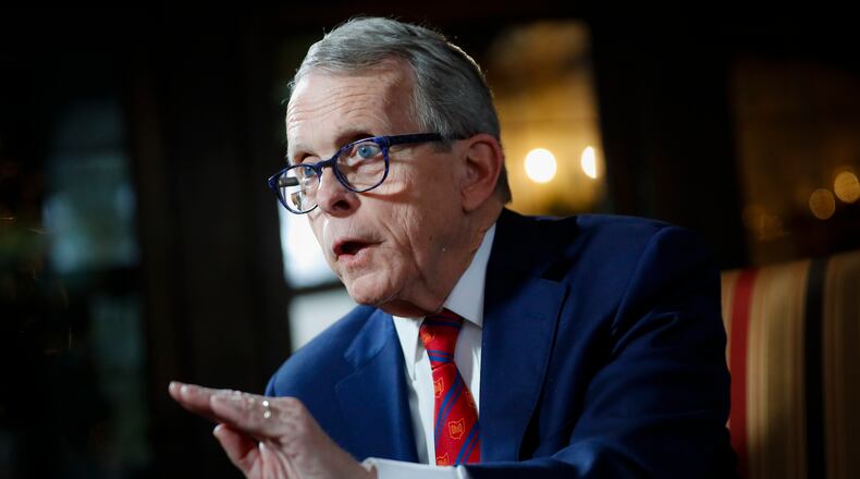 FILE - In this Dec. 13, 2019, file photo, Ohio Gov. Mike DeWine speaks during an interview at the Governor's Residence in Columbus, Ohio. (AP Photo/John Minchillo, File)