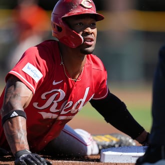 Cincinnati Reds' Will Benson steals third base against the San Francisco Giants during the first inning of a spring training baseball game Friday, March 6, 2026, in Scottsdale, Ariz. (AP Photo/Ross D. Franklin)