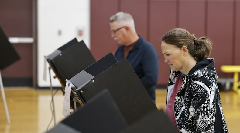 Carleen and Bobby Thompson vote at Elda Elementary School Tuesday, May 2, 2023 in Ross Twp. Residents were voting on a levy for Ross schools. NICK GRAHAM/STAFF