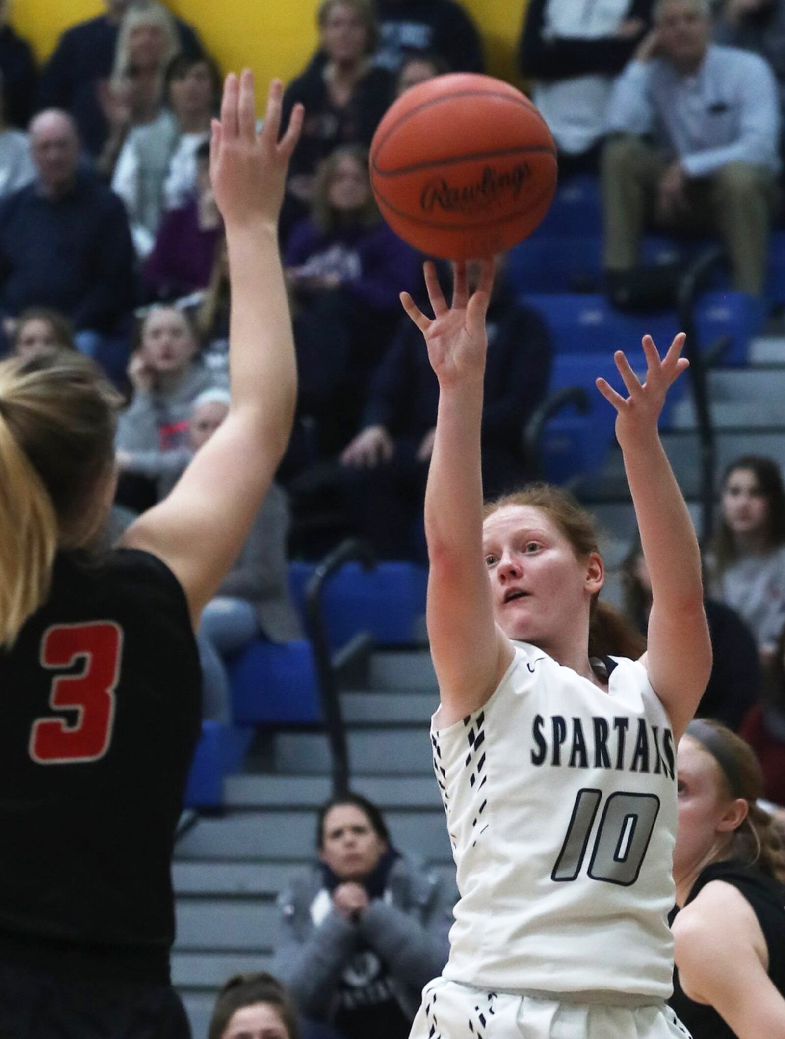 Valley View's Abigail Dickson launches a 3-pointer over Franklin's Kaylee Harris during Tuesday night's Division II regional semifinal at Springfield. Franklin won 47-39 in overtime. BILL LACKEY/STAFF