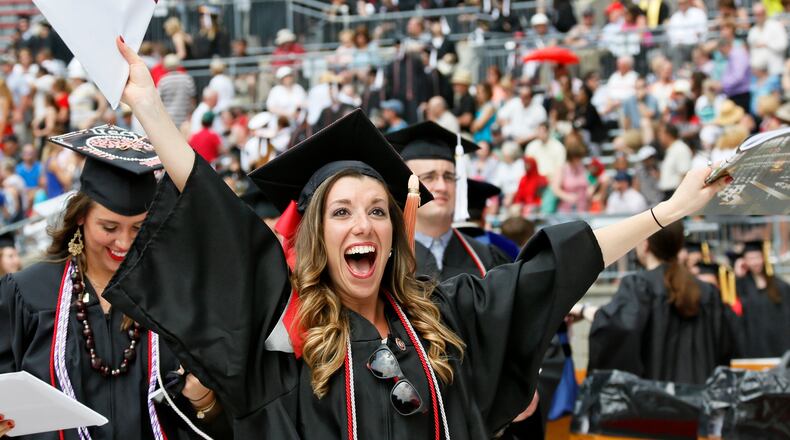 Holly Hazelton celebrates receiving her degree in Nursing as Ohio State University held commencement exercises for around 10,000 graduates on Sunday, May 10, 2015 at Ohio Stadium. (Dispatch Photo by Barbara J. Perenic)