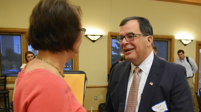 West Chester Twp. Trustee George Lang, pictured talking with Liberty Twp. Trustee Christine Matacic on Sept. 7, was sworn in on Sept. 13 as the 52nd Ohio House District representative. MICHAEL D. PITMAN/FILE