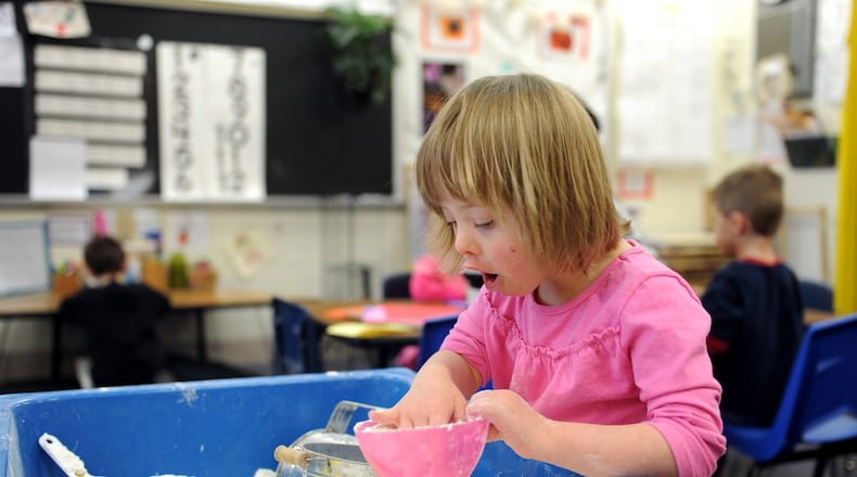 In this 2012 file photo, a student plays at the sensory table in a preschool class at Lakota’s Creekside Early Childhood School. For the first time, Lakota Local Schools has won the state’s top rating for preschool programs. The Ohio Department of Education’s 5-Star rating was recently awarded to preschool programs at Lakota and Talawanda in Butler County and to Franklin City Schools in Warren County. STAFF FILE PHOTO/2012