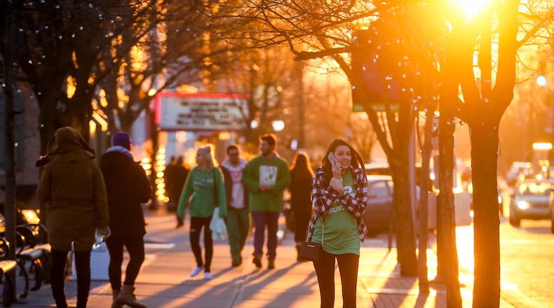 Miami University students and others take part in Green Beer Day in March in Oxford. GREG LYNCH / STAFF