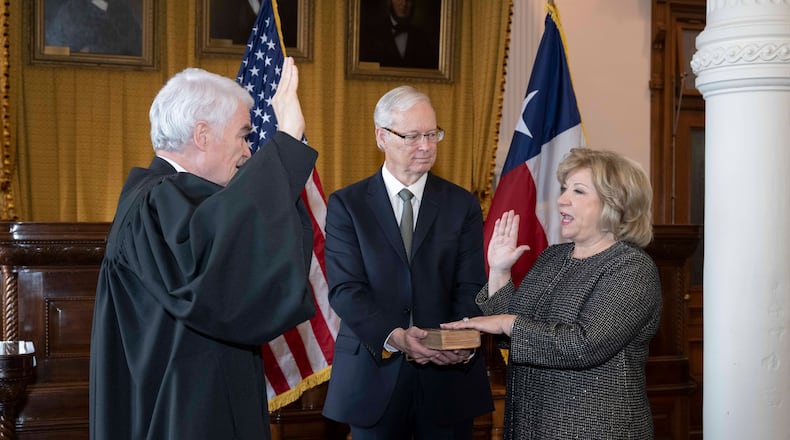 Former Texas Sen. Jane Nelson, of Flower Mound, is sworn in as the 115th Secretary of State by Chief Justice Nathan Hecht in the Supreme Court room at the Texas Capitol. Her husband, J. Michael Nelson, holds a bible during the ceremony. CREDIT: Bob Daemmrich/for the Texas Secretary of State's Office