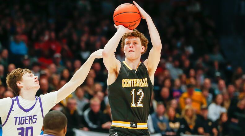 Centerville High School senior Tom House shoots the ball over Pickerington Central junior Gavin Headings during the Division I state championship game on Sunday night at UD Arena. CONTRIBUTED PHOTO BY MICHAEL COOPER