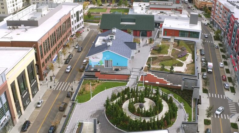 Liberty Center has applied for Designated Outdoor Refreshment Area (DORA) status with the township. This rooftop garden at Liberty Center has a spiral walkway, Sabin Hall, TriHealth Triumph gardens and Unity Chapel and Kona Grill near The Square. TY GREENLEES / STAFF