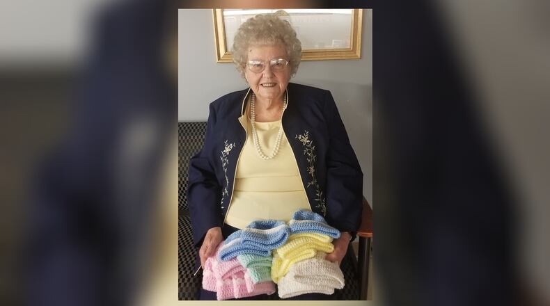 In her 28 years as a volunteer for Atrium Medical Center, Betty Banks has knitted 6,000 baby hats and 50 afghans for local newborns.