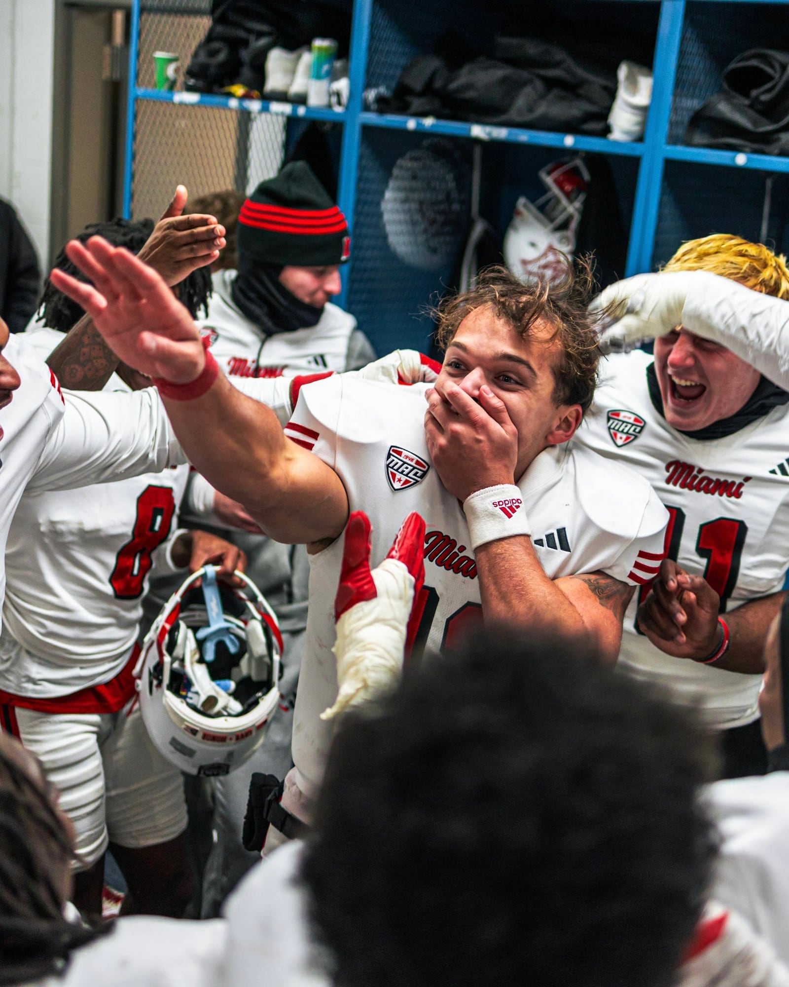 Miami quarterback Thomas Gotkowski celebrates with his teammates following a 37-20 victory over Buffalo last week at Buffalo. MIAMI ATHLETICS PHOTO