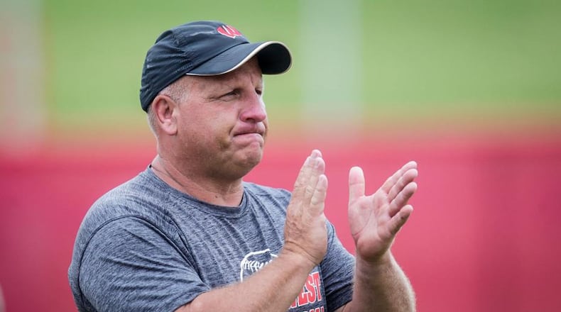 Lakota West coach Keith Castner encourages his team during the Division I state championship game against Massillon Perry on June 2 at Firestone Stadium in Akron. NICK GRAHAM/STAFF