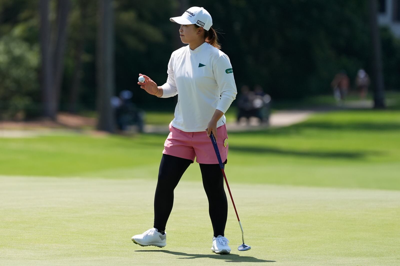 Mao Saigo, of Japan, reacts to her putt on the second green during the third round of the Chevron Championship LPGA golf tournament Saturday, April 26, 2025, in The Woodlands, Texas. (AP Photo/Ashley Landis)