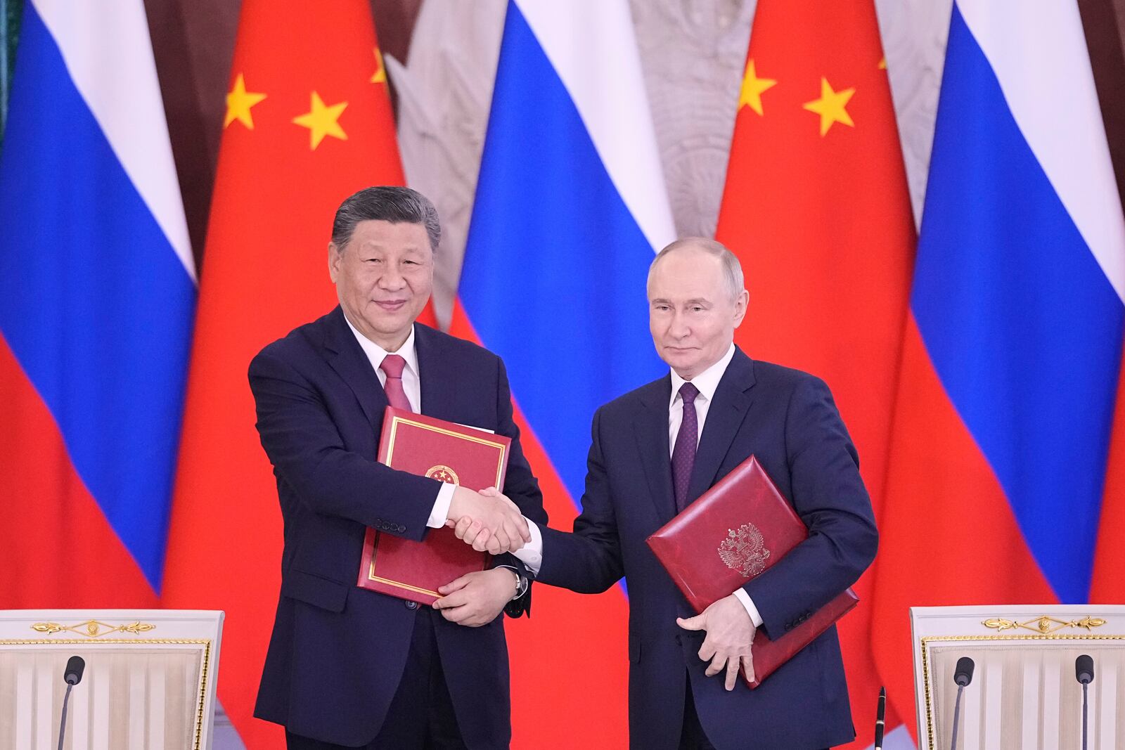 Russian President Vladimir Putin, right, and Chinese President Xi Jinpin attend a signing ceremony after their meeting at the Kremlin in Moscow, Russia, Thursday, May 8, 2025, ahead of celebrations of the 80th anniversary of the Soviet Union's victory over Nazi Germany during the World War II. (AP Photo/Pavel Bednyakov)