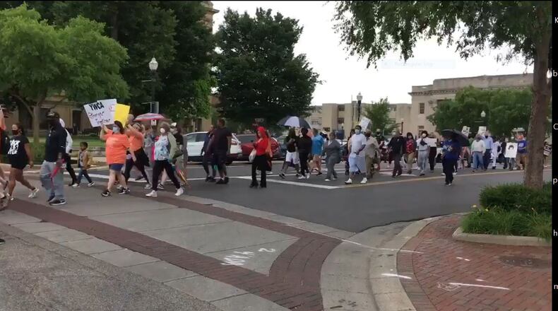 More than 150 demonstrators march through downtown Hamilton on Saturday, June 13, for justice and racial equality in the wake of George Floyd’s death. MICHAEL D. CLARK/STAFF