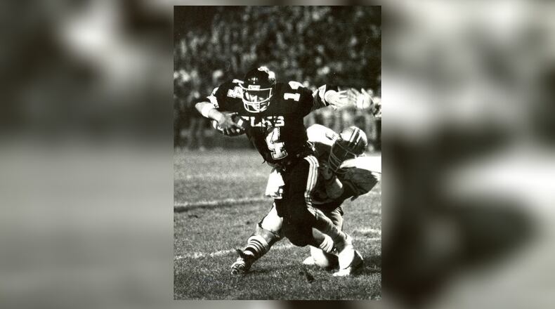 As a junior in 1986 (seen here against Fairmont), Herbstreit set a Centerville record with 317 passing yards in a game. That Elks team went 10-1 with a playoff appearance. DDN FILE
