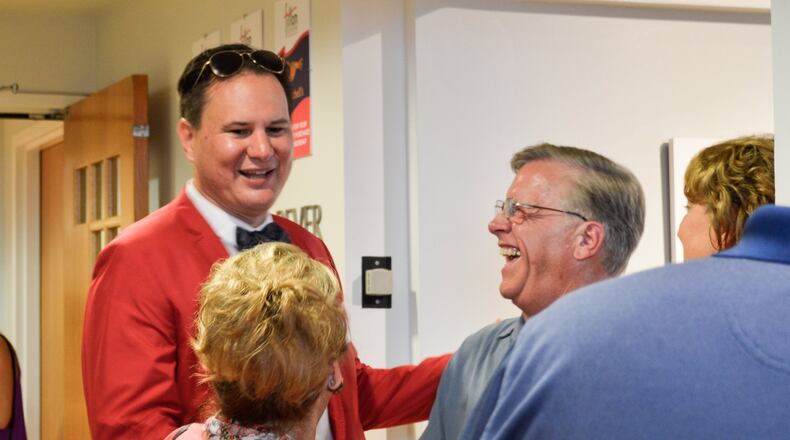 Fitton Center for Creative Arts Executive Director Ian MacKenzie-Thurley greets guests during a previous event. The organization’s annual “Building.Community” fundraising campaign is underway and will run through mid-April. CONTRIBUTED / ISABEL DINGELDEIN